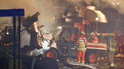 Members of the emergency services move debris at the site of an explosion which destroyed a convenience store and a home in Leicester, Britain, February 25, 2018. REUTERS/Darren Staples