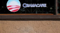 FILE PHOTO: A sign on an insurance store advertises Obamacare in San Ysidro, San Diego, California, U.S., October 26, 2017. REUTERS/Mike Blake/File Photo