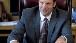 FILE PHOTO: Kansas Secretary of State Kris Kobach talks about the Kansas voter ID law that he pushed to combat what he believes to be rampant voter fraud in the United States in his office in Topeka, Kansas, U.S., on May 12, 2016. REUTERS/Dave Kaup/File Photo