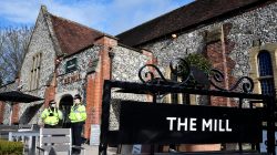Police officers stand outside a pub near to where former Russian inteligence officer Sergei Skripal, and his daughter Yulia were found unconscious after they had been exposed to an unknown substance, in Salisbury, Britain, March 7, 2018. REUTERS/Toby Melville