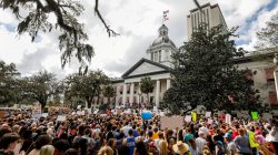 FILE PHOTO: Protestors rally outside the Capitol urging Florida lawmakers to reform gun laws, in the wake of last week's mass shooting at Marjory Stoneman Douglas High School, in Tallahassee, Florida, U.S., February 21, 2018. REUTERS/Colin Hackley/File Photo