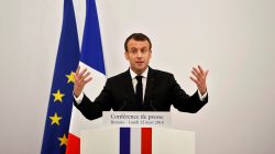 FILE PHOTO: French President Emmanuel Macron gestures as he addresses a news conference in Varanasi, India, March 12, 2018. REUTERS/Adnan Abidi
