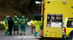 Members of the emergency services wearing protective suits work at a site in Winterslow, near Salisbury, Britain, March 12, 2018. REUTERS/Henry Nicholls