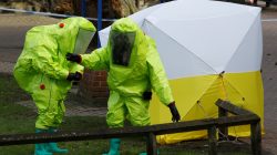 The forensic tent, covering the bench where Sergei Skripal and his daughter Yulia were found, is repositioned by officials in protective suits in the centre of Salisbury, Britain, March 8, 2018. REUTERS/Peter Nicho