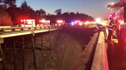 Emergency service vehicles gather on Interstate 10 at the scene of a bus crash in Baldwin County, Alabama, U.S., March 13, 2018 in this still image obtained from social media video. Jesus Tejeda via REUTERS