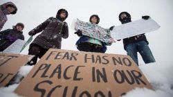 A small group of anti-gun protesters hold a vigil outside the Vermont State