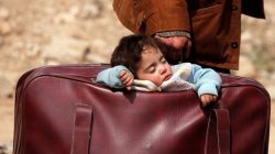 A child sleeps in a bag in the village of Beit Sawa, eastern Ghouta, Syria March 15, 2018. REUTERS/Omar Sanadiki