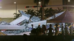 First responders are shown as rescue efforts continue after a pedestrian bridge collapsed at Florida International University in Miami, Florida, U.S., March 15, 2018. REUTERS/Joe Skipper