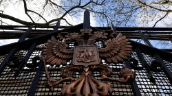 A coat of arms is seen on a gate outside of the Russian embassy in London, Britain, March 16, 2018. REUTERS/Toby Melv