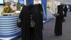 FILE PHOTO: Saudi Arabian women, seeking a job, talk with recruiters during a job fair in Riyadh January 25, 2012. REUTERS/ Stringer