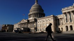 People walk by the U.S. Capitol building in Washington, U.S., February 8, 2018. REUTERS/Leah Millis/File Photo