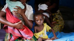 An internally displaced woman sits with her severely acute malnourished children as they wait to receive medical attention at the Tshiamala general referral hospital of Mwene Ditu in Kasai Oriental Province in the Democratic Republic of Congo, March 15, 2018. REUTERS/Thomas Mukoya