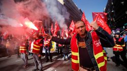 Protestors light flares as they attend a demonstration during a national day of strike against reforms in Marseille, France, March 22, 2018. REUTERS/Jean-Paul Pelissier