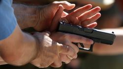 Instructors work with participants on proper gun handling during a firearms training class at the PMAA Gun Range in Salt Lake City, Utah, July 1, 2016. REUTERS/Jim Urquhar