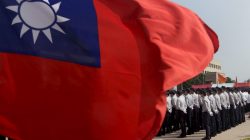 FILE PHOTO: Members of the National Security Bureau take part in a drill next to a national flag at its headquarters in Taipei, Taiwan, November 13, 2015. REUTERS/Pichi C