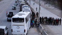 FILE PHOTO: Rebel fighters gather and pray before they leave, at the city limits of Harasta, in the eastern Damascus suburb of Ghouta, Syria March 22, 2018. REUTERS/Omar Sanadiki