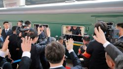 FILE PHOTO: North Korean leader Kim Jong Un waves from a train, as he paid an unofficial visit to China, in this undated photo released by North Korea's Korean Central News Agency (KCNA) in Pyongyang March 28, 2018. KCNA/via Reuters/File Photo