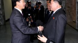 South Korean Unification Minister Cho Myoung-gyon is greeted by his North Korean counterpart Ri Son Gwon as he arrives for their meeting at the truce village of Panmunjom, North Korea, March 29, 2018. Korea Pool/Yonhap via REUTERS