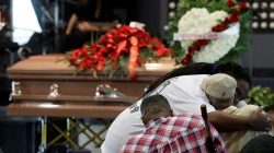 Mourners embrace before the funeral services for police shooting victim, Stephon Clark at Bayside Of South Sacramento Church, in Sacramento, California, March 29, 2018. Jeff Chiu/Pool via Reuters