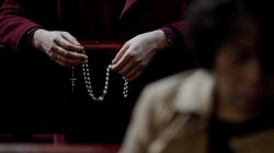 FILE PHOTO: A Catholic faithful holds a rosary during a mass on Holy Thursday at the Cathedral of the Immaculate Conception in Beijing, China March 29, 2018. REUTERS/Damir Sagolj/File Photo