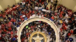 FILE PHOTO - Teachers pack the state Capitol rotunda to capacity, on the second day of a teacher walkout, to demand higher pay and more funding for education, in Oklahoma City, Oklahoma, U.S., April 3, 2018. REUTERS/Nick Oxford