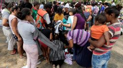 Central American migrants receive donated clothes as they take a break from traveling in their caravan, on their journey to the U.S., in Matias Romero, Oaxaca, Mexico April 3, 2018. REUTERS/Henry Romero