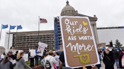 Teachers rally outside the state Capitol for the second day of a teacher walkout to demand higher pay and more funding for education in Oklahoma City, Oklahoma, U.S., April 3, 2018. REUTERS/Nick Oxford