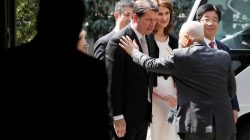 A family member of a Japanese national abducted by North Korean agents greets U.S. ambassador to Japan William Hagerty after their meeting in Tokyo, Japan, April 10, 2018. REUTERS/Kim Kyung-Hoon