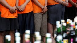 Suspects arrested over the production and sale of illegal alcohol which claimed the lives of more than 80 people this week in Jakarta and nearby West Java province, are seen during a police a press conference in Jakarta, Indonesia April 11, 2018. REUTERS/Willy Kurniawan