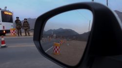 Policemen control a check point after preventing Reuters reporters from driving through, near the border of China and North Korea, just outside the village of Sanhe, China, November 25, 2017. REUTERS/Damir Sagolj