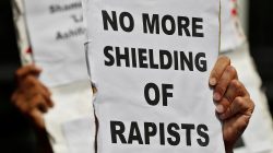 People hold placards at a protest against the rape of an eight-year-old girl, in Kathua, near Jammu and a teenager in Unnao, Uttar Pradesh state, in New Delhi, India April 12, 2018. REUTERS/Cathal McNaughton