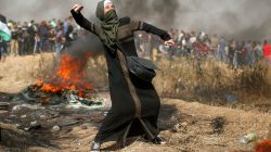 A girl hurls stones during clashes with Israeli troops at a protest where Palestinians demand the right to return to their homeland, at the Israel-Gaza border, east of Gaza City, April 13, 2018. REUTERS/Mohammed Salem