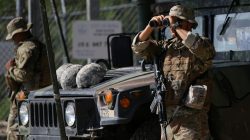FILE PHOTO: Members of the Texas National Guard watch the Mexico-U.S. border from an outpost along the Rio Grande in Roma, Texas, U.S., April 11, 2018. REUTERS/Loren Elliott