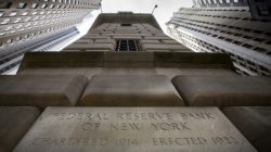 FILE PHOTO: The corner stone of the New York Federal Reserve Bank is seen surrounded by financial institutions in New York City, New York, U.S., March 25, 2015. REUTERS/Brendan McDermid/File Photo