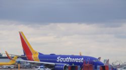 Emergency personnel monitor the damaged engine of Southwest Airlines Flight 1380, which diverted to the Philadelphia International Airport this morning after the airline crew reported damage to one of the aircraft's engines, on a runway in Philadelphia, Pennsylvania U.S. April 17, 2018. REUTERS/Mark Makela