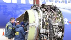 U.S. NTSB investigators are on scene examining damage to the engine of the Southwest Airlines plane in this image released from Philadelphia, Pennsylvania, U.S., April 17, 2018. NTSB/Handout via REUTERS