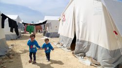 Limar and Masa al-Qari, child survivors of the suspected poison gas attack, walk outside a tent for the displaced, in the Northern Aleppo countryside, Syria April 17, 2018. Picture taken April 17, 2018. REUTERS/Mahmoud Hassano