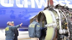 U.S. NTSB investigators are on scene examining damage to the engine of the Southwest Airlines plane in this image released from Philadelphia, Pennsylvania, U.S., April 17, 2018. NTSB/Handout via REUTERS
