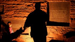 People visit the Columbine memorial after teens kicked off a voter registration rally, a day ahead of the 19th anniversary of the massacre at Columbine High School, in Littleton, Colorado, U.S., April 19, 2018. REUTERS/Rick Wilking
