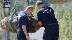 Police officers look at a dismantled World War Two bomb at a construction site next to the central train station in Berlin, Germany, April 20, 2018. REUTERS/Axel Schmidt