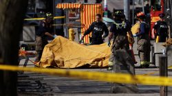 Firemen cover a victim of an incident where a van struck multiple people at a major intersection in Toronto's northern suburbs, in Toronto, Ontario, Canada, April 23, 2018. REUTERS/Carlo Allegri