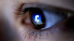 FILE PHOTO: A picture illustration shows a Facebook logo reflected in a person's eye, in Zenica, March 13, 2015. REUTERS/Dado Ruvic/Illustration/File Photo