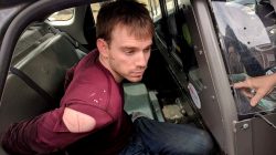 Travis Reinking, the suspect in a Waffle House shooting in Nashville, is under arrest by Metro Nashville Police Department in a wooded area in Antioch, Tennessee, U.S., April 23, 2018. Courtesy Metro Nashville Police Department/Handout via REUTERS