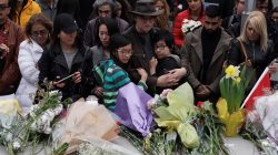 Mourners attend a makeshift memorial a day after a van struck multiple people along a major intersection in north Toronto, Ontario, Canada, April 24, 2018. REUTERS/Carlo Allegr