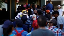 A group of Central American migrants, moving in a caravan through Mexico, arrive at the office of Mexico's National Institute of Migration to start the legal process and get temporary residence status for humanitarian reasons, in Hermosillo, Sonora state, Mexico April 24, 2018. REUTERS/Edgard Garrido