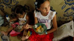 Juliani Caceres, grand daughter of Carmen Penaloza, have rice and platain for lunch at her home in San Cristobal, Venezuela April 5, 2018. Picture taken April 5, 2018. REUTERS/Carlos Eduardo Ramirez