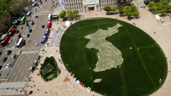 The shape of the Korean peninsula is seen on the lawn in front of City Hall ahead of the upcoming summit between North and South Korea in Seoul, South Korea April 25, 2018. REUTERS/Jorge Si