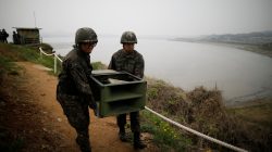 South Korean soldiers move loudspeakers that were set up for propaganda broadcasts near the demilitarized zone separating the two Koreas in Paju, South Korea, May 1, 2018. REUTERS/Kim Hong-Ji/Pool