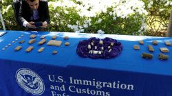 A man photographs artifacts on display, as U.S. Immigration and Customs Enforcement (ICE) hosts an event to return several thousand ancient artifacts to the Republic of Iraq, at the Iraqi ambassador's residence in Washington, DC, U.S., May 2, 2018. REUTERS/Kevin Lamarque
