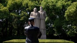 A man walks in front of the statue of German philosophers Karl Marx and Friedrich Engels at a park in Shanghai, China May 3, 2018. REUTERS/Aly Song